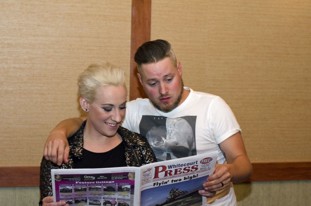 Amanda and Tyler Wilkinson read the Whitecourt Press for email